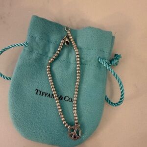 Tiffany & Co. Silver Beaded Bracelet with Peace Charm